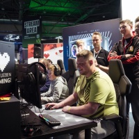 Visitors testing gaming hardware