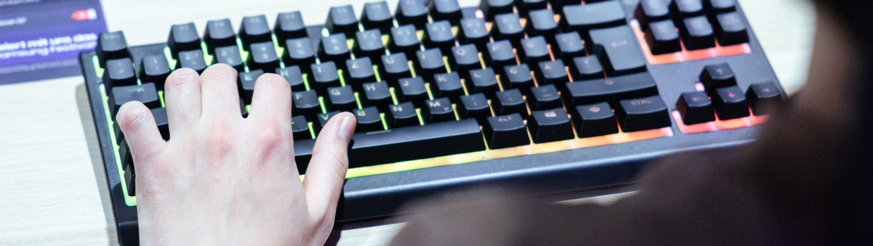 Visitors testing gaming keyboard